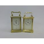 Two brass and glass panelled carriage clocks to include the London Clock company, etc (2)