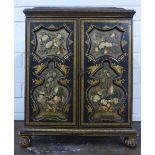 A 19th century chinoiserie lacquered table cabinet, with a cavetto moulded top which lifts to reveal