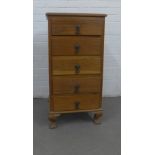 An oak chest of narrow proportions, with five drawers and short cabriole legs, 46 x 92 x 40cm