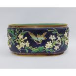 Majolica oval planter, blue glazed with humming bird pattern and a turquoise interior, (a/f)