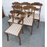 Set of six Regency style mahogany dining chairs with scroll carved toprails and upholstered