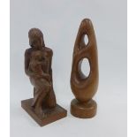 Two wooden sculptures, one depicting a mother and child and the other an abstract figure, (2)