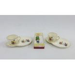 Pair of vintage Alfred Meakin Ceylon tea cups and saucers with a novelty glass Pelican bottle