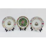 A pair of Chinese 18th century porcelain plates with floral borders and basket of flowers pattern,