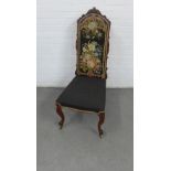 A 19th century chair with a carved toprail and tapestry upholstered back and seat, on cabriole