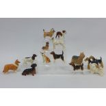 A collection of fourteen Beswick dog figures (14)