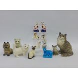 A collection of thirteen cat figures to include Beswick and Staffordshire,etc (13)