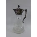 Epns and glass claret jug with a star cut base, 28cm high