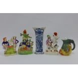 Collection of Staffordshire flatback figures, spill vases and a Delft blue and white vase,