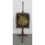 19th century rosewood pole screen with an embroidered screen, contained within a fret frame