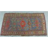 Kazak type rug, pale blue field with flowerhead motifs and geometric borders, 280 x 154cm