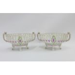Pair of continental porcelain baskets, each with a transfer printed bird and butterfly pattern,