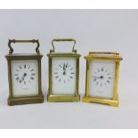 Three brass and glass panelled carriage clocks, to include Whytock & Sons, Dundee, Bornand Freres