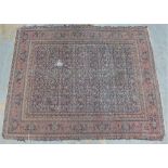 Large North West Persian rug, faded blue field with allover foliate design, 236 x 190cm (a/f)