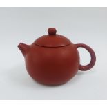Yixing globular teapot, circa 20th century, with a large loop handle and with impressed dragon and