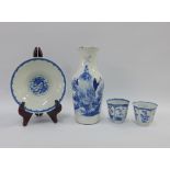 Chinese blue and white porcelains to include a baluster vase, dragon pattern bowl and pair of tea