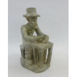 African carved soapstone figure of a Cobbler, 27cm high