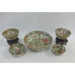 Collection of Chinese Qing famille rose bowls, various sizes, two with pierced wooden stands, (a/f)