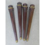 Set of four mahogany fluted tale legs with brass caps, 66cm long (4)