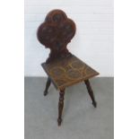 Oak chair with carved circular motifs, on turned legs, 42 x 92cm