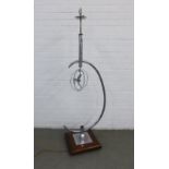 Art Deco chrome plated steel floor lamp, circa 1930, with a dancing girl and square mahogany base,