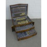 An early 20th century oak cutlery canteen containing a set of Epns flatware, over three trays