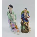 Two Chinese figures, one of a female modelled seated and reading, tallest 21cm (2)