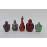 A collection of five Chinese hardstone snuff bottles, tallest 10cm (5)