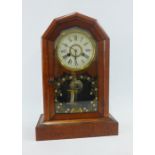 Early 20th century Junghans clock with a painted glass door and stained wooden case, complete with
