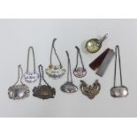 Collection of eight decanter labels to include silver, enamel and Epns examples, an Epns caddy spoon
