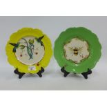 Two nature Table plates designed by Lou Rota, one with a bee and the other with humming birds, (2)