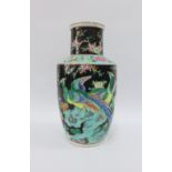 Chinese famille noir vase painted with peacocks. peonies and blossoms, 30cm