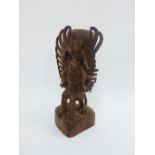 Vishnu astride Garuda, a hardwood carving (a/f) 27cm high