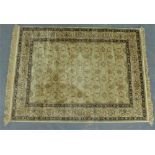 Wool rug with beige field and allover foliate design, 162 x 118cm