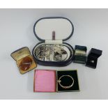 A collection of silver and costume jewellery to include a stiff hinged bangle, pendants, brooches,