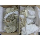 Two boxes containing a quantity of lace braiding and fabrics, etc together with a stitched