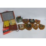 Mixed lot to include a quantity of heraldic plaques, vintage Johnson Card Shuffler, Mahjong set