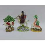 19th century Staffordshire figures to include a giraffe and bocage figure, a cow and calf bocage
