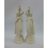 Pair of Parian female water carrier figures, 37cm high (2) (a/f)