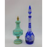 A late 19th century pale blue glass vase and cover and a flashed blue glass decanter and stopper,