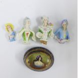 Four porcelain dolly heads and an Austrian porcelain jar and cover, 9cm long (5)
