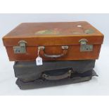 Two vintage travel suitcases, one containing a suite of blue enamel and gilt metal accessories to