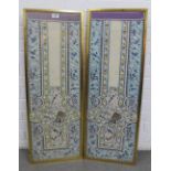 Pair of Chinese or Japanese silk embroidered panels with peacocks, roosters and other birds within a