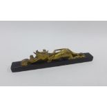 Chinese gilt and lacquered scroll weight with dragon, 24cm long
