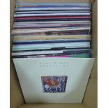A carton containing vintage vinyl LPs to include Beatles Sergeant Pepper Lonely Hearts Band, Elton