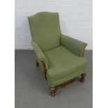 Green upholstered armchair with an oak carolean style stretcher 68 x 86cm