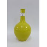 Chinese yellow glazed vase with a six character mark to the base, 23cm high