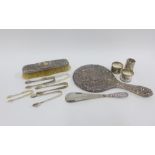 Mixed lot to include silver sugar tongs, silver napkin rings, silver glass holder, silver handled
