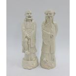 Pair of Chinese crackle glazed figures of Lohans, 23cm high (2)