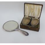 George V silver backed hand mirror, Birmingham 1912, together with a cased set of two Gents silver